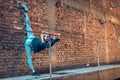 flexible young woman lifting leg extremely high