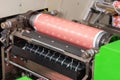 Flexographic machine with ink tray and varnish, ceramic anilox roll, doctor blade and a print cylinder with photopolymer. Royalty Free Stock Photo