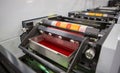 Flexographic printing machine with an ink tray, ceramic anilox roll, doctor blade and a print cylinder with polymer relief plate Royalty Free Stock Photo