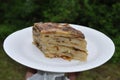 Flia multiple crÃªpe-like layers with cream and served with sour cream and butter