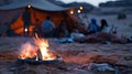 The flicker of a campfire casts a warm glow on the faces of a family peacefully sleeping in traditional Bedouin tents Royalty Free Stock Photo