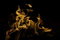 Flickering fire tongues on black background