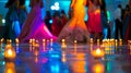 The flickering flames of the candles illuminate the dance floor highlighting the vibrant colors of the students attire