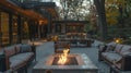 Flickering flames reflect off the surrounding furniture casting a warm and cozy light on the outdoor seating area. 2d