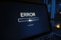 Login Screen Displaying Error Message With Flickering Graphics in a Dimly Lit Workspace During a Late-Night Session Royalty Free Stock Photo