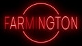 Glowing and blinking red retro neon sign for FARMINGTON