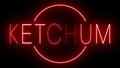 Glowing and blinking red retro neon sign for KETCHUM