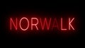 Glowing and blinking red retro neon sign for NORWALK