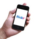 Flickr phone in hand Royalty Free Stock Photo