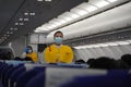 Flight attendant of airline instructs the passengers of liner on safety and tells how to use the device during an emergency.