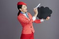 flight attendant asian woman showing blank cloud shape board Royalty Free Stock Photo
