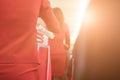 flight attendant serving food to passenger on aircraft. stewardess offer drink on board. hostess with trolley Royalty Free Stock Photo