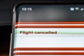 Flight cancelled text on smart phone screen