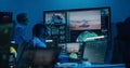 Flight control operators monitor space mission on computers in command center Royalty Free Stock Photo