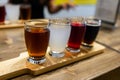 Flight craft beer glasses on wooden tray