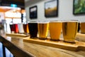 Flight craft beer glasses on wooden tray