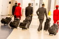 Flight crew walking with lugagge in airport Royalty Free Stock Photo