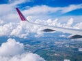 Flight Dortmund-Kyiv.July 2018 .View from airplane window: wing of `wizzair` plane in cloudy sky. Royalty Free Stock Photo