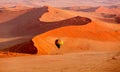 Hot air balloon in flight against orange sand dunes in Sossusvlei Namibia Royalty Free Stock Photo