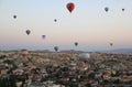 Flight of hot air balloons at dawn over a valley in Cappadocia (Turkey) near the town of Goreme Royalty Free Stock Photo