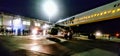 Flight late dark airport lights asphalt airplane ryanair Royalty Free Stock Photo