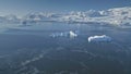 Flight over Antarctica polar ocean, snow mountain. Royalty Free Stock Photo