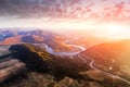 Flight over the autumn mountains with mountain road serpentine Royalty Free Stock Photo