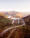 Flight over the autumn mountains with mountain road serpentine Royalty Free Stock Photo