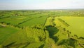 Flight over British countryside with green and yellow fields