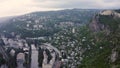 Flight over of the center city, mining town Chiatura famous for its manganese mines being situated on Kvirila river. Evening summe