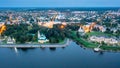 Flight over evening city of Uglich and Epiphany Cathedral on banks of Volga River