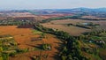 Flight over the fields behind the western Ukrainian village Aerial view. Royalty Free Stock Photo