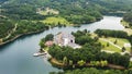 Flight over a large hotel on a beautiful mountain lake