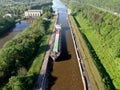 Flight over the river. Passage of hydraulic locks on the channel by commercial cargo ship
