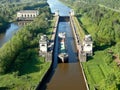 Flight over the river. Passage of hydraulic locks on the channel by commercial cargo ship