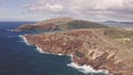 Flight over rocky coast of tropical island of Oahu Hawaii. View of Hanauma Bay. Kalanianaole Highway South Shore Oahu Royalty Free Stock Photo