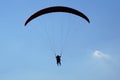 Flight paraglider at noon, under clear skies