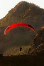 The flight of paragliders in the highlands. Paragliding at dawn. Taking photos from a heigh Royalty Free Stock Photo