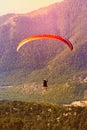 The flight of paragliders in the highlands. Paragliding at dawn. Taking photos from a height. Royalty Free Stock Photo