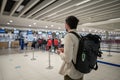 Flight rules during Covid-19 pandemic only in protective face mask. New normal concept. Masked man with phone in hand