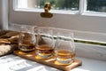 Flight of single malt scotch whisky served on old wooden window sill in Scottisch house in Edinburgh, Scotland, UK Royalty Free Stock Photo