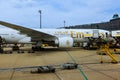 During flight from terminal Vienna Airport in Austria, Emirates is loading its baggage at plane