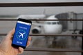 Flight on time notification on Smartphone announces good news to tourist