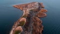 Flight under the island with only birds. Bird island. Aerial view of flying birds under the island.