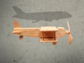 The flight wood airplane with the shadow plane Royalty Free Stock Photo