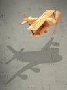The flight wood airplane with the shadow plane Royalty Free Stock Photo