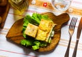 Flija - baked puff pastry with cream or cheese. Served on lettuce leaf. Albanian or Kosovo cuisine