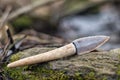 Flint knife - stone age tool leaf blade in deer antler Royalty Free Stock Photo