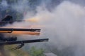 Flintlock muzzle loader muskets guns firing. Smoke from the gunpowder fills the air