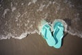 Flip Flop Sandals in the Water at the Beach Royalty Free Stock Photo